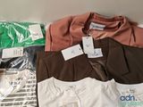 a pile of clothing that is sitting on a table