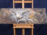 tableau représentant un aigle posé sur un chevalet en bois, sur fond bleu
