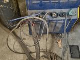 a blue machine that is sitting in the garage
