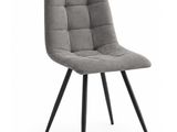une chaise grise aux pieds noirs sur fond blanc