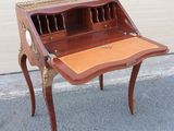 an antique writing desk with a drawer on top of it