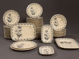 a lot of plates that are sitting on a table