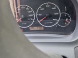 a close up of a car dashboard with a speedometer and gauges