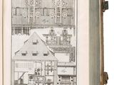 an open book with a drawing of a house on it ' s cover