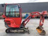 a red excavator that is parked in a parking lot