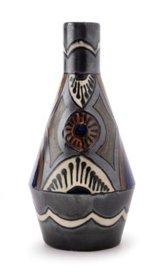 a black and white vase with a design on it