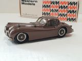 a toy car sitting on a table next to a box of western models