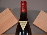a bottle of wine that is sitting on a table