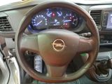 dashboard of a car with a steering wheel and gauges on it
