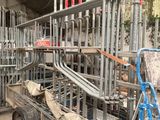 a cart that has a lot of metal pipes on it