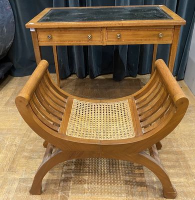 a wooden bench with a glass top on a wooden floor