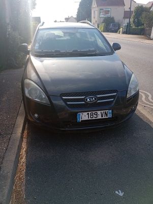 a black car parked on the side of the road