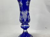 an image of a blue glass vase on a white background