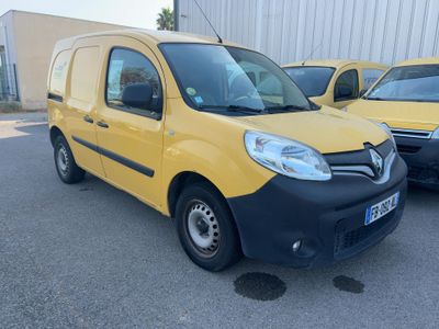 yellow and black van parked in a parking lot next to other cars