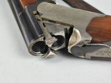 a close up of a gun that is laying on a table