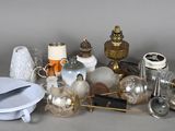 many different types of glass and metal items on the table