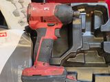 an image of a cordless drill is in a red case