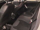 the interior of a small car with black leather seats and black trims