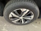 a close up of a tire on a car ' s rim