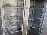 a metal cabinet with shelves and shelves inside of it