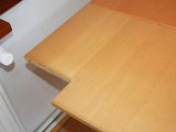 a close up of a kitchen counter with a wooden counter top