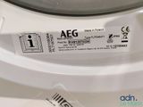 a label on the front of a washing machine that says aeg