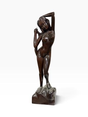 an image of a bronze statue of a woman holding her hands on her head