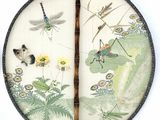a picture of a fan with a dragonfly and flowers on it