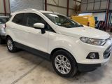 the white ford eco - pace is parked in a garage