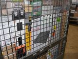 a metal cage filled with assorted items in a warehouse