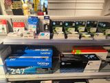 a lot of brother products on the shelves in the store