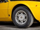 a yellow car parked in front of a brick building