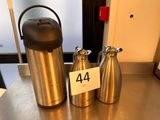 two different types of water bottles on the table