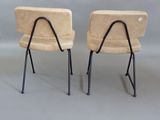 pair of mid - century chairs with black metal legs and a tan upholstered upholstered upholstered upholstered upholstered