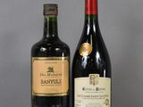 two bottles of wine that are sitting on a table