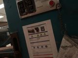 a picture of a machine that is working on a piece of paper