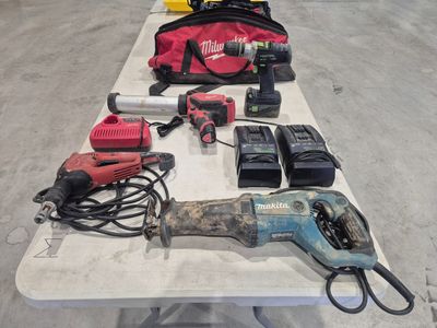 a table with tools on it and a bag on the table