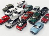 a lot of toy cars that are on the table