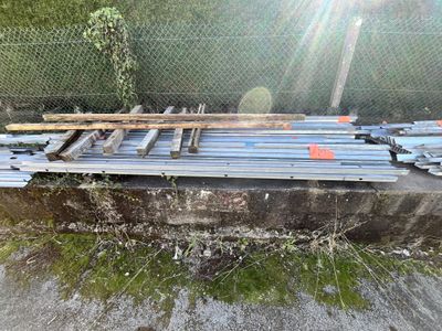 a pile of steel bars sitting on the ground