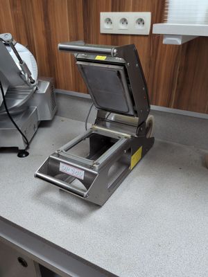a machine that is sitting on a counter in a kitchen