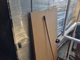 a pile of boxes and a ladder in a room