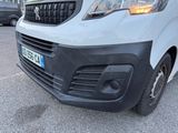 a white van that is parked in a parking lot