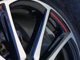 a close up view of a wheel on a car