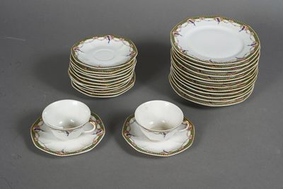 a lot of plates and cups sitting on a table