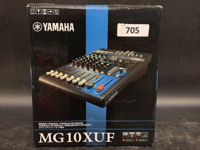 a box of yamaha mg10xuf analog mixing console