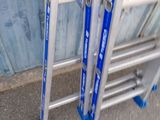 two ladders that are sitting next to each other