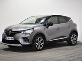 a grey toyota c - hr suv parked on a checkered floor