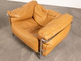 pair of leather lounge chairs in the style of the sixties