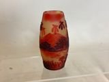a small vase that is sitting on a clear shelf