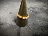 a small cone with a ring on top of it
